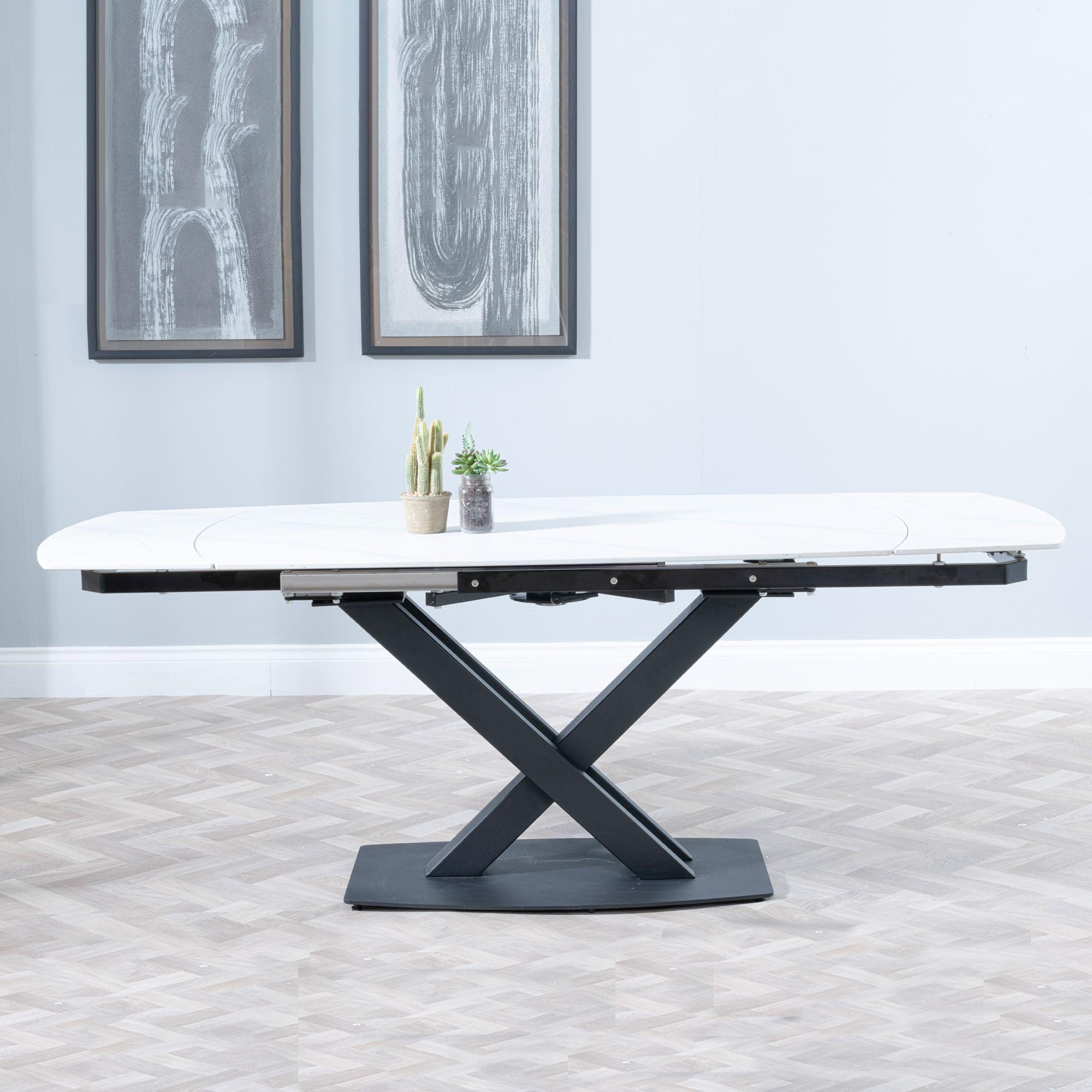 Product photograph of Arctic White Ceramic Swivel Top Extending Dining Table With Black Cross Base - 140cm-200cm from Choice Furniture Superstore.