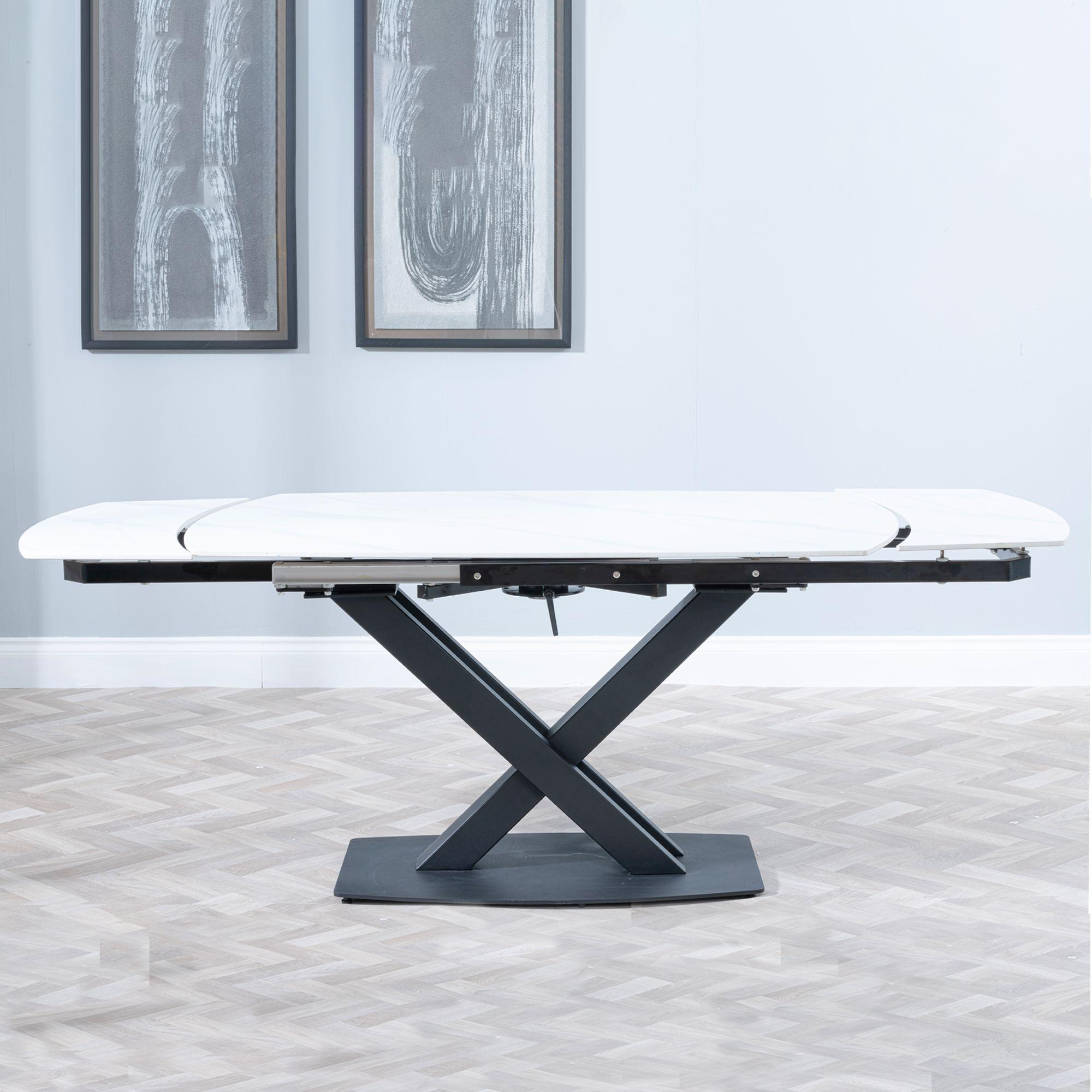 Product photograph of Arctic White Ceramic Swivel Top Extending Dining Table With Black Cross Base - 140cm-200cm from Choice Furniture Superstore.
