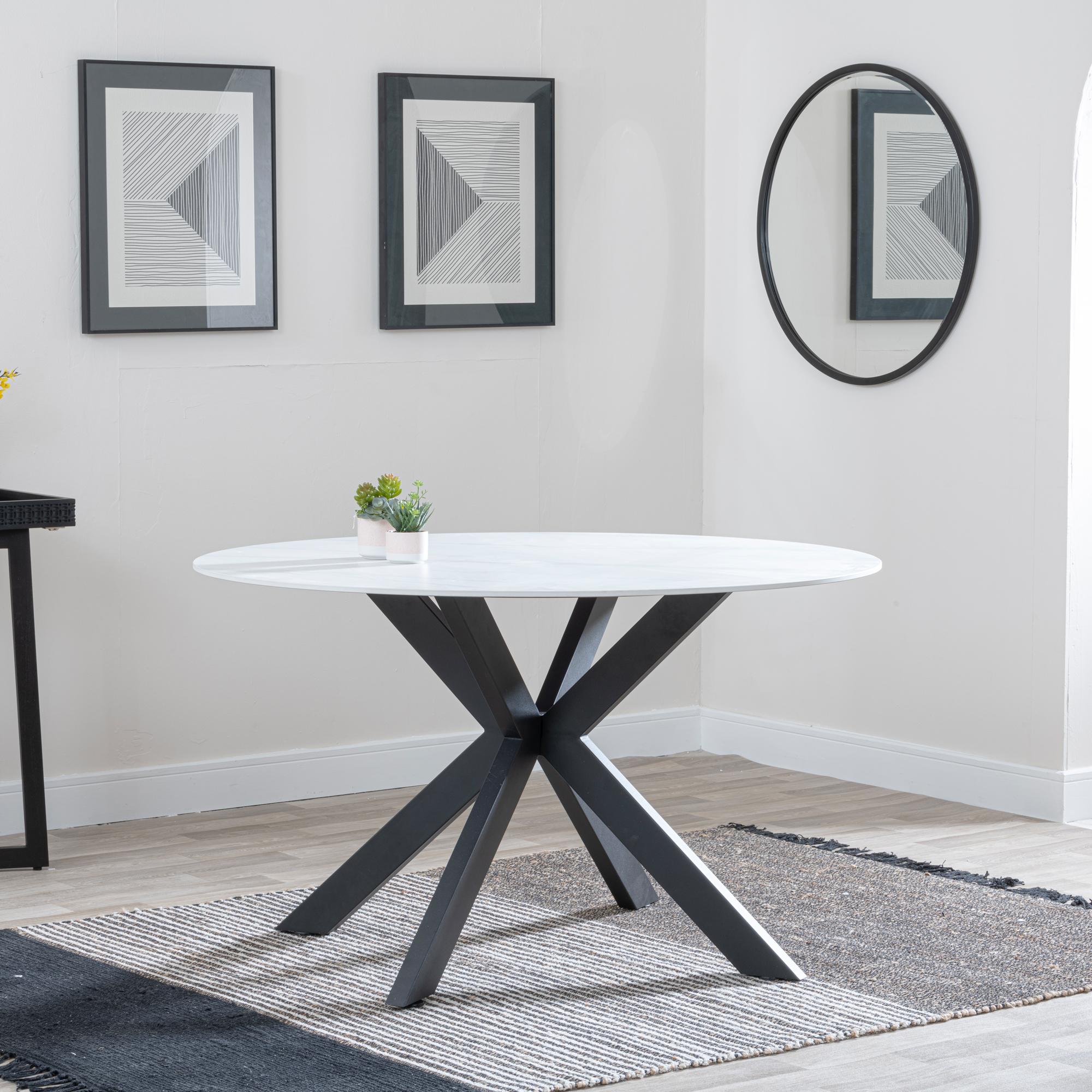 Product photograph of Novara 130cm White Ceramic Round Dining Table With Black Star Base from Choice Furniture Superstore.