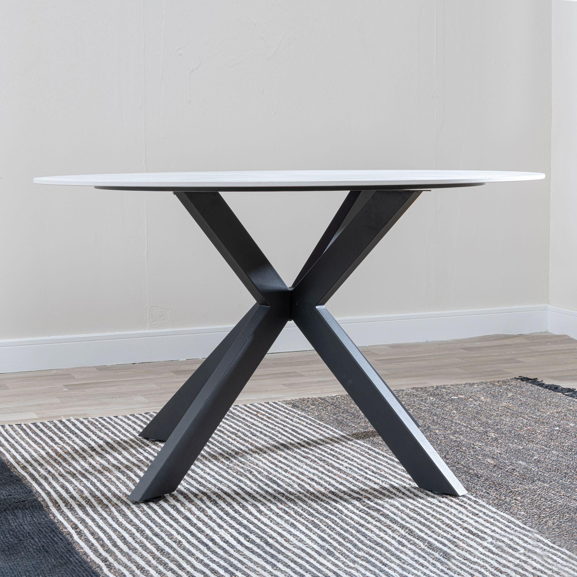 Product photograph of Novara 130cm White Ceramic Round Dining Table With Black Star Base from Choice Furniture Superstore.