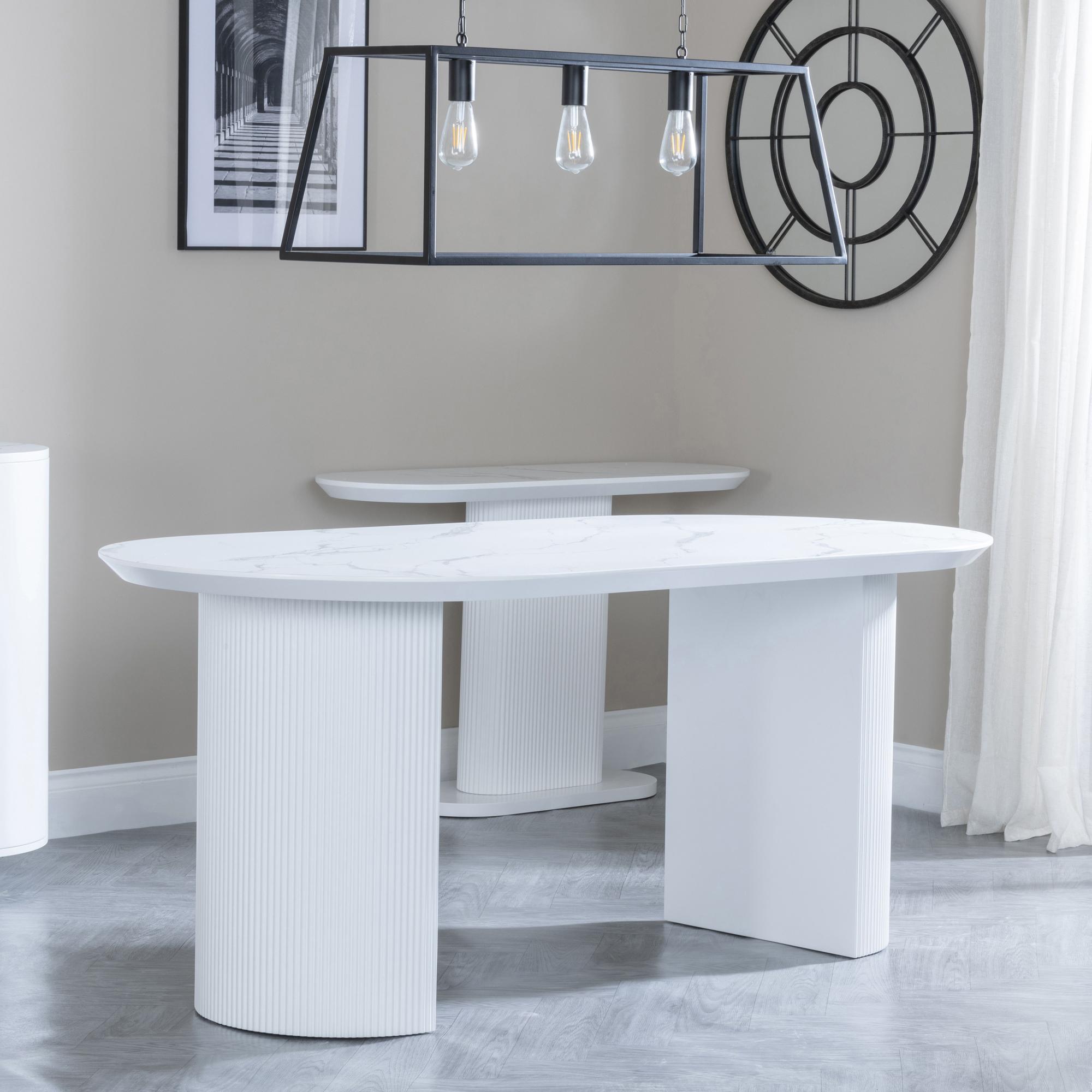 Product photograph of Luxor 6 Seater White Marble Effect Oval Dining Table - Fluted Base from Choice Furniture Superstore.