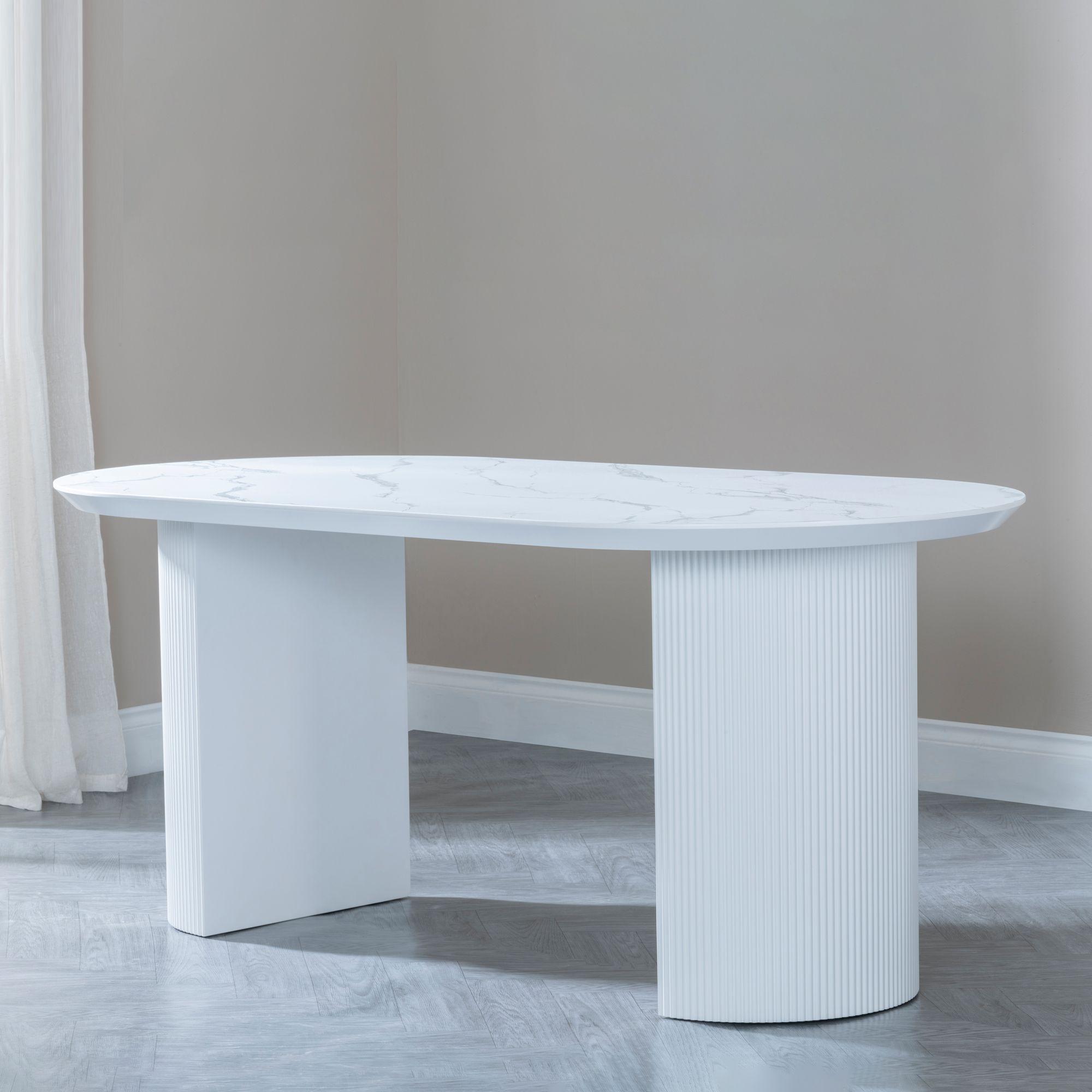 Product photograph of Luxor 6 Seater White Marble Effect Oval Dining Table - Fluted Base from Choice Furniture Superstore.