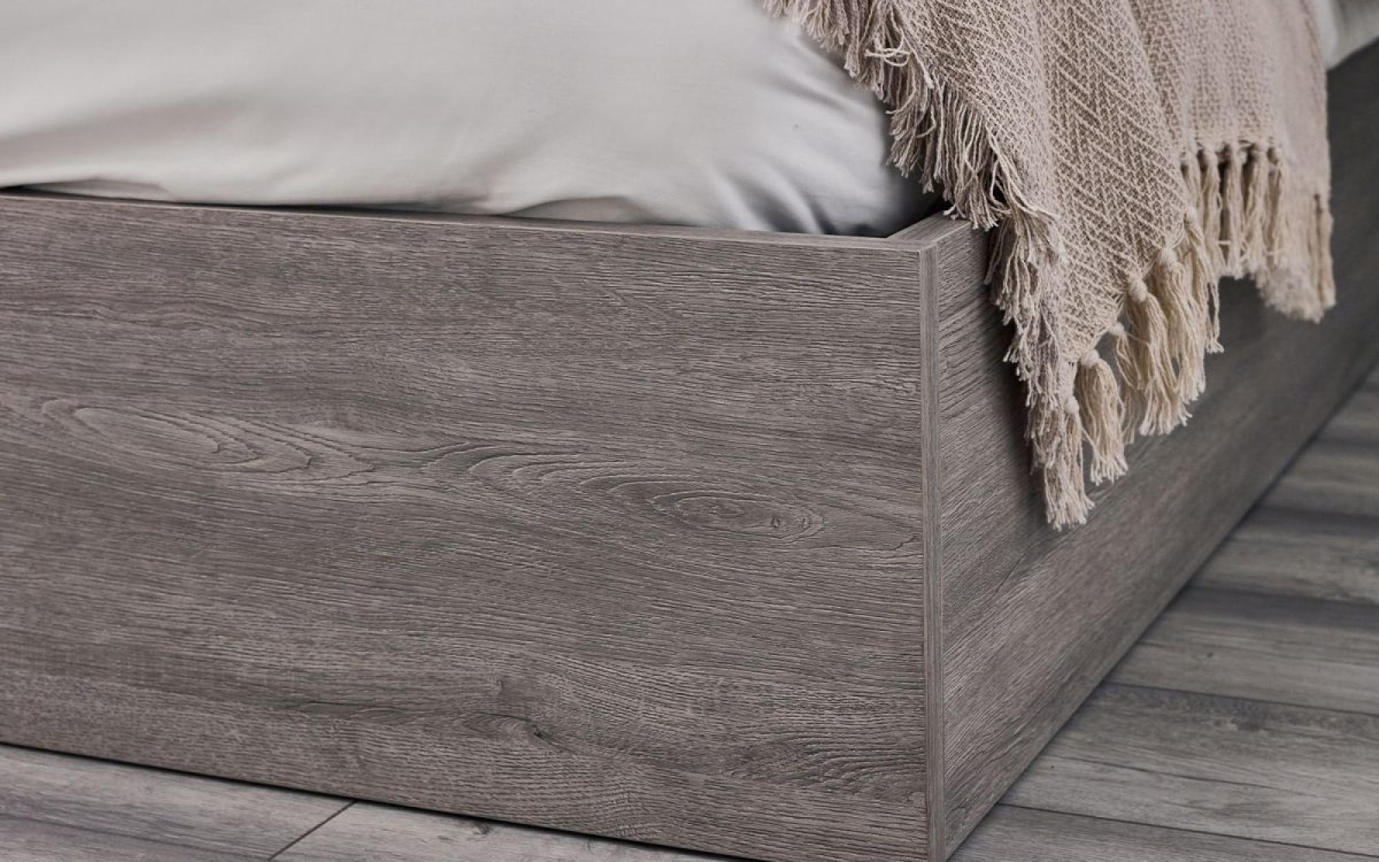 Product photograph of Bali Grey Oak Ottoman Storage Bed - Sizes Available from Choice Furniture Superstore.