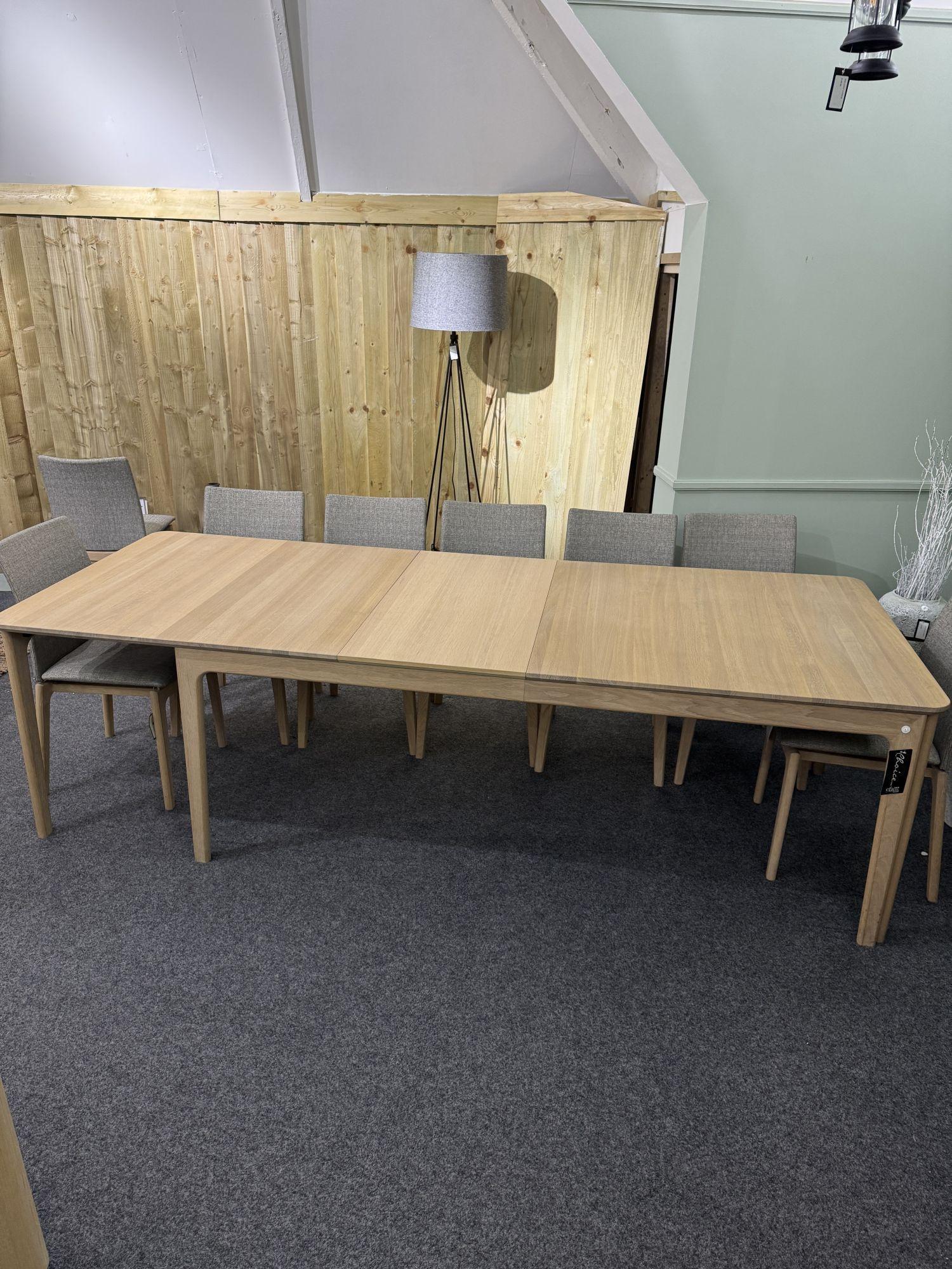 Product photograph of Ex Display - Skovby Sm27 Oak 8-20 Seater Extending Dining Table from Choice Furniture Superstore.