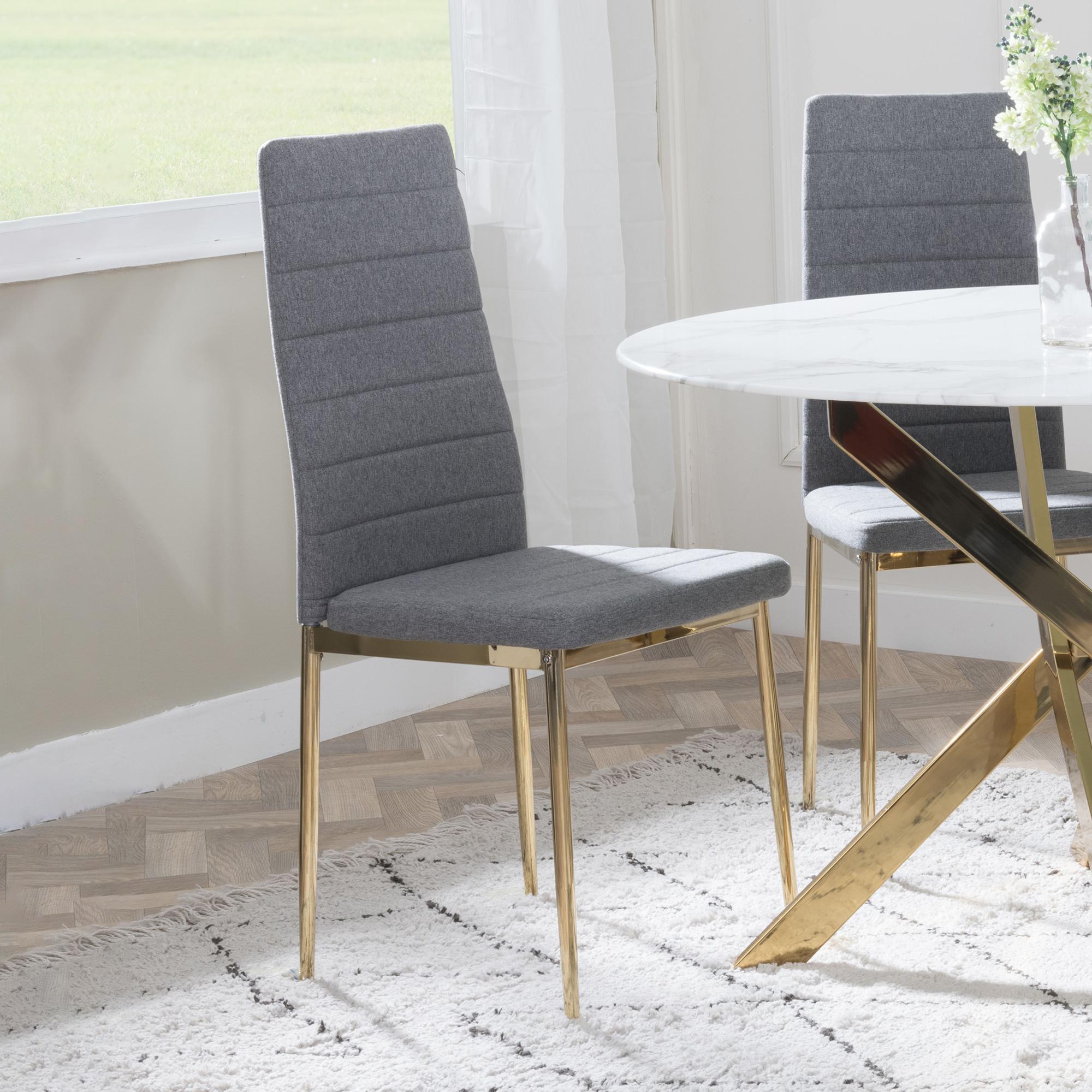 Product photograph of Chopstick Clear Glass And Gold Metal 4 Seater Round Dining Set - 2 Lido Dark Grey Fabric Chairs With Gold Legs - Get 2 Chairs Free from Choice Furniture Superstore.
