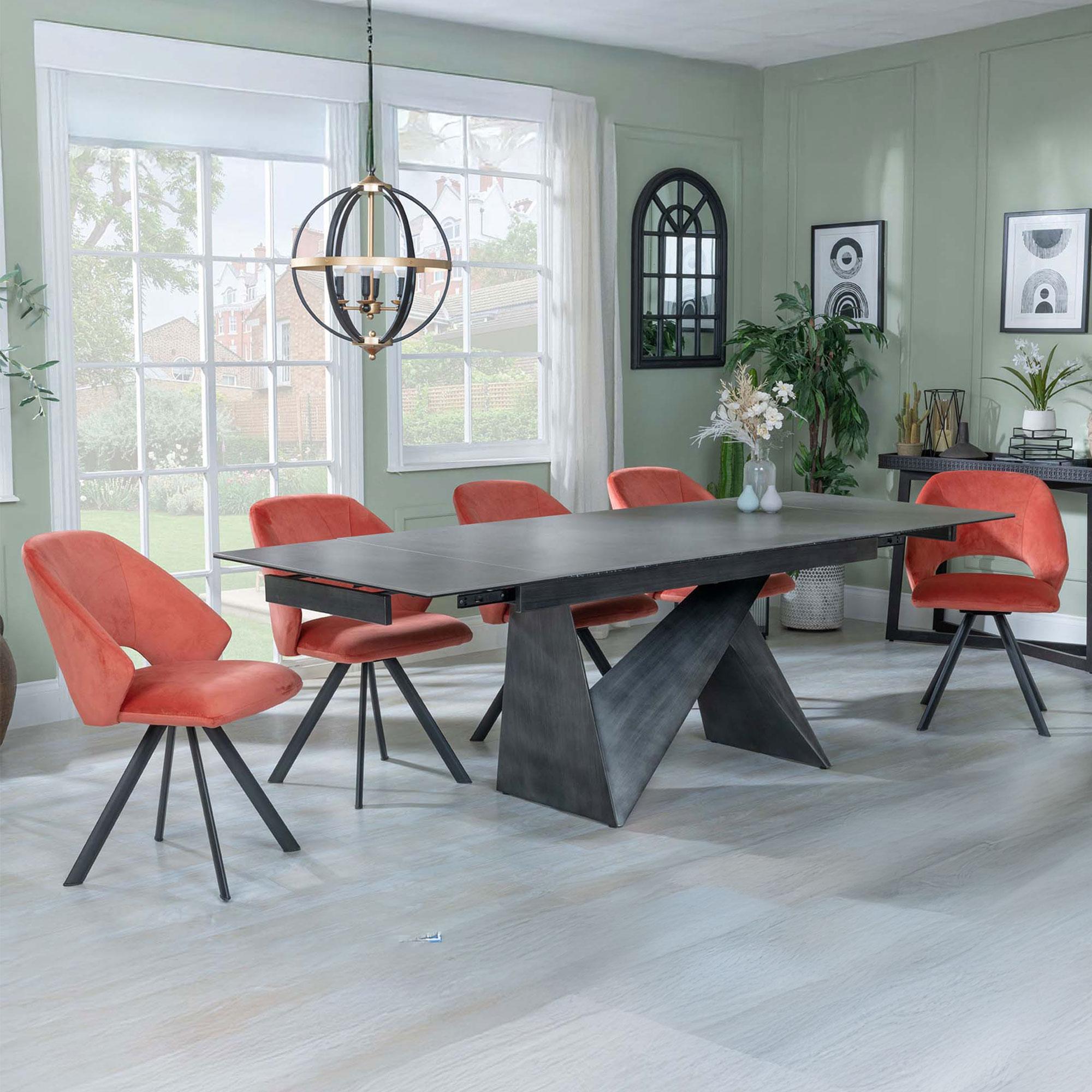 Product photograph of Garvin Dark Grey Ceramic Extending Dining Set - Ion Orange Velvet Fabric Swivel Dining Chair from Choice Furniture Superstore.