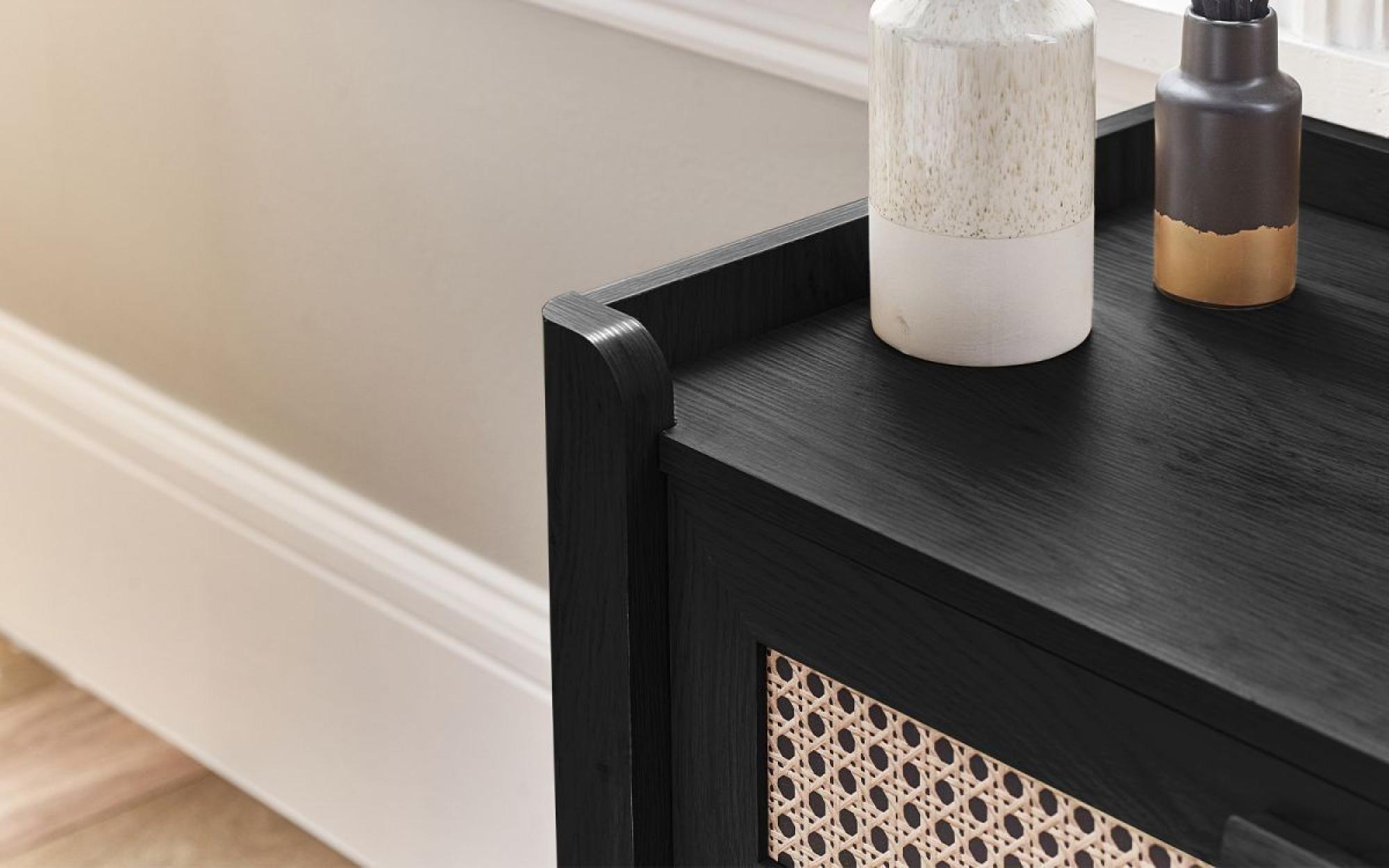Product photograph of Sydney Black And Faux Rattan 5 Drawer Chest from Choice Furniture Superstore.