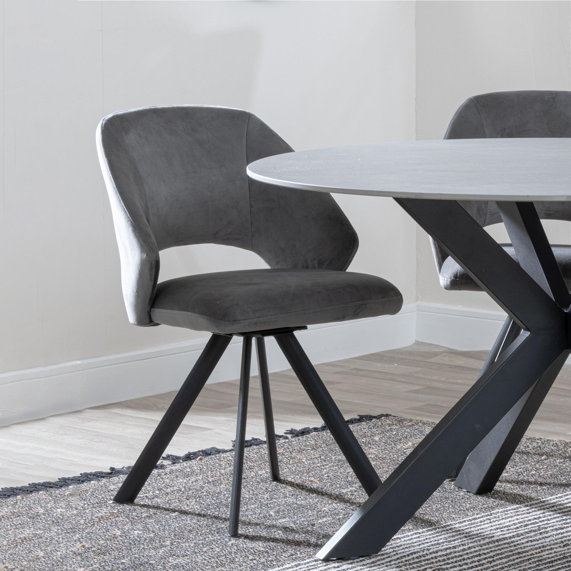 Product photograph of Ezra Grey Concrete Effect Dining Set With Spider Legs - Ion Dark Grey Velvet Fabric Swivel Dining Chair from Choice Furniture Superstore.