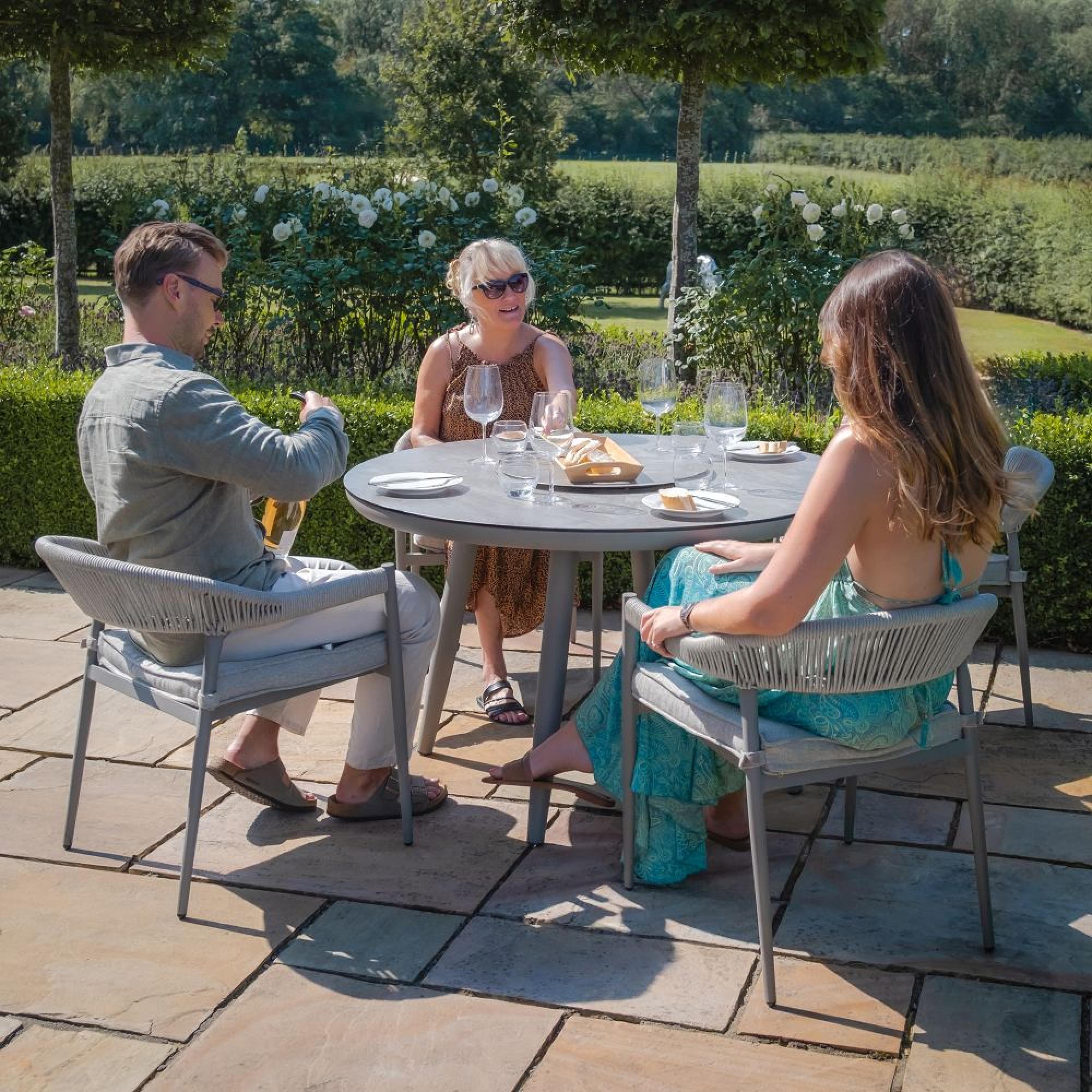 Product photograph of Maze Florence Cool Linen 4 Seat Lazy Susan Round Dining Set from Choice Furniture Superstore.