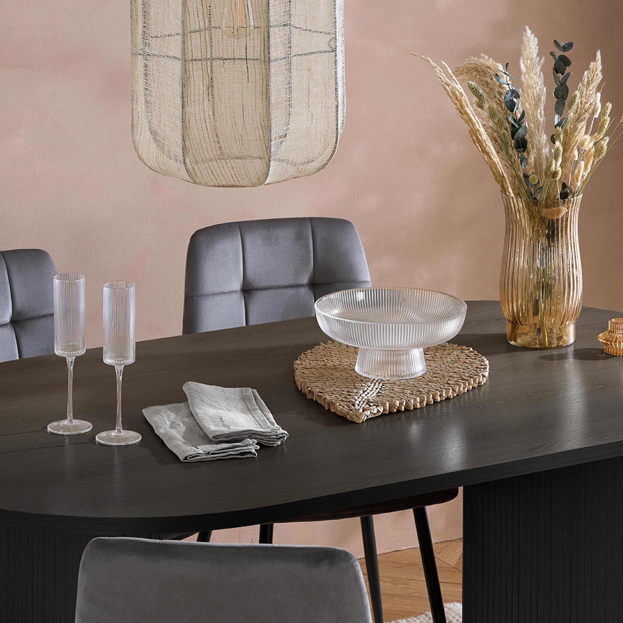 Product photograph of Axel Black Fluted 6 Seater Oval Dining Table from Choice Furniture Superstore.