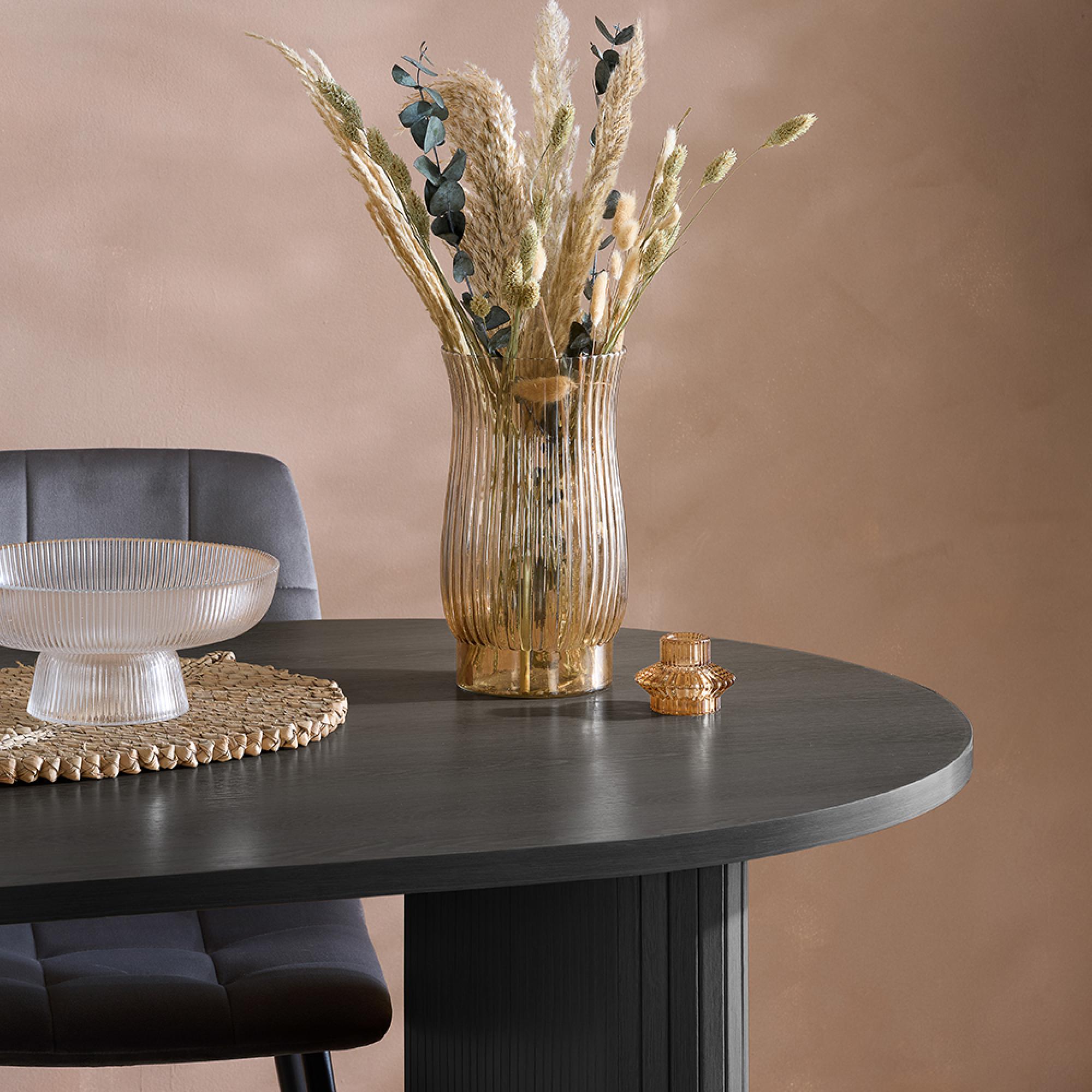 Product photograph of Axel Black Fluted 6 Seater Oval Dining Table from Choice Furniture Superstore.