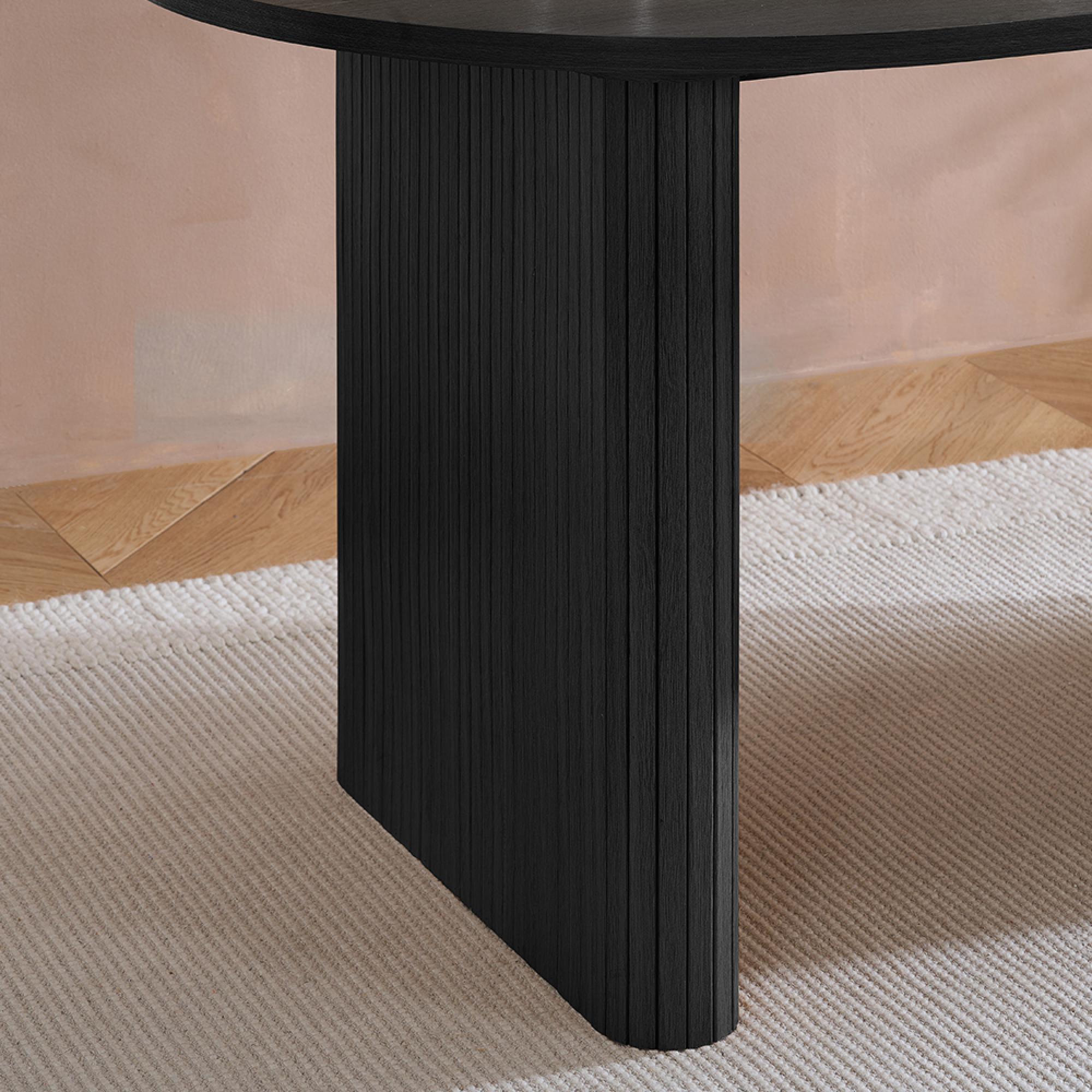 Product photograph of Axel Black Fluted 6 Seater Oval Dining Table from Choice Furniture Superstore.