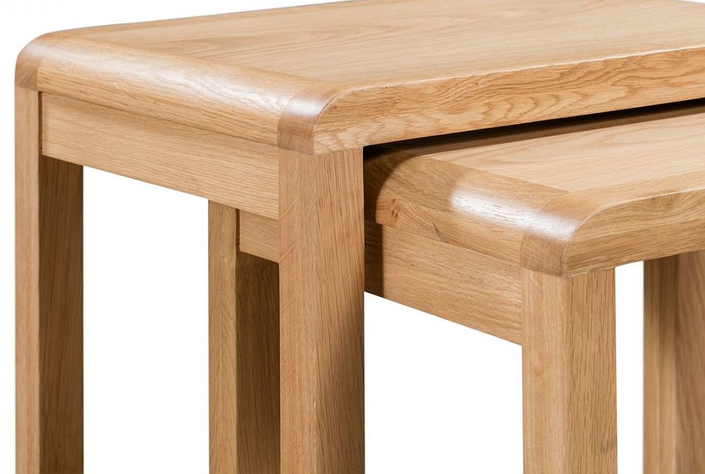 Product photograph of Curve Oak Nest Of 2 Tables from Choice Furniture Superstore.
