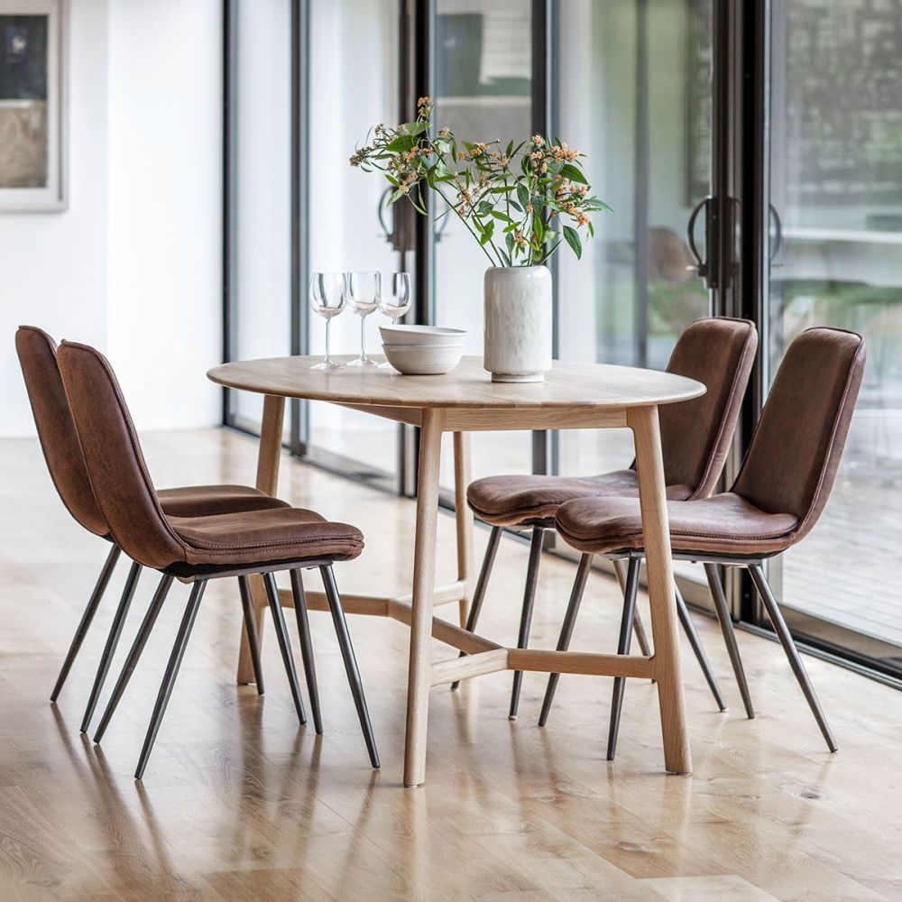 Product photograph of Madrid Oak Oval 6 Seater Dining Table from Choice Furniture Superstore.