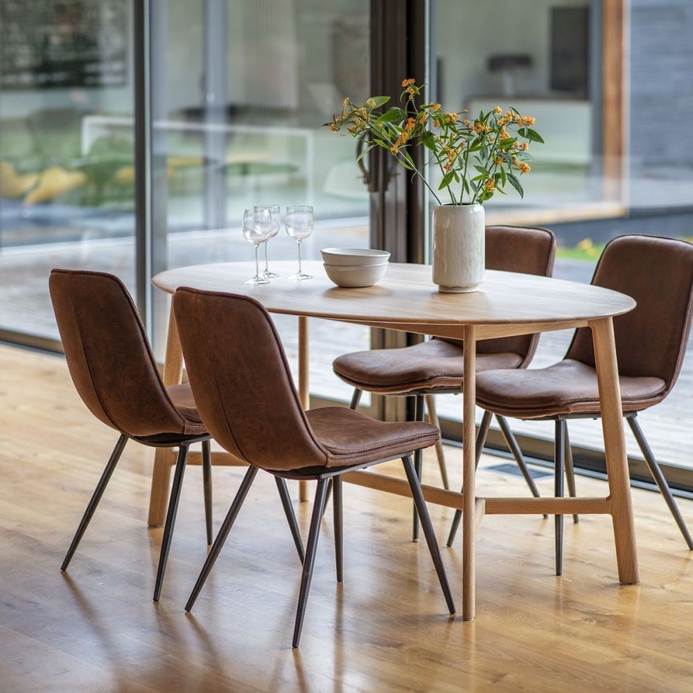 Product photograph of Madrid Oak Oval 6 Seater Dining Table from Choice Furniture Superstore.