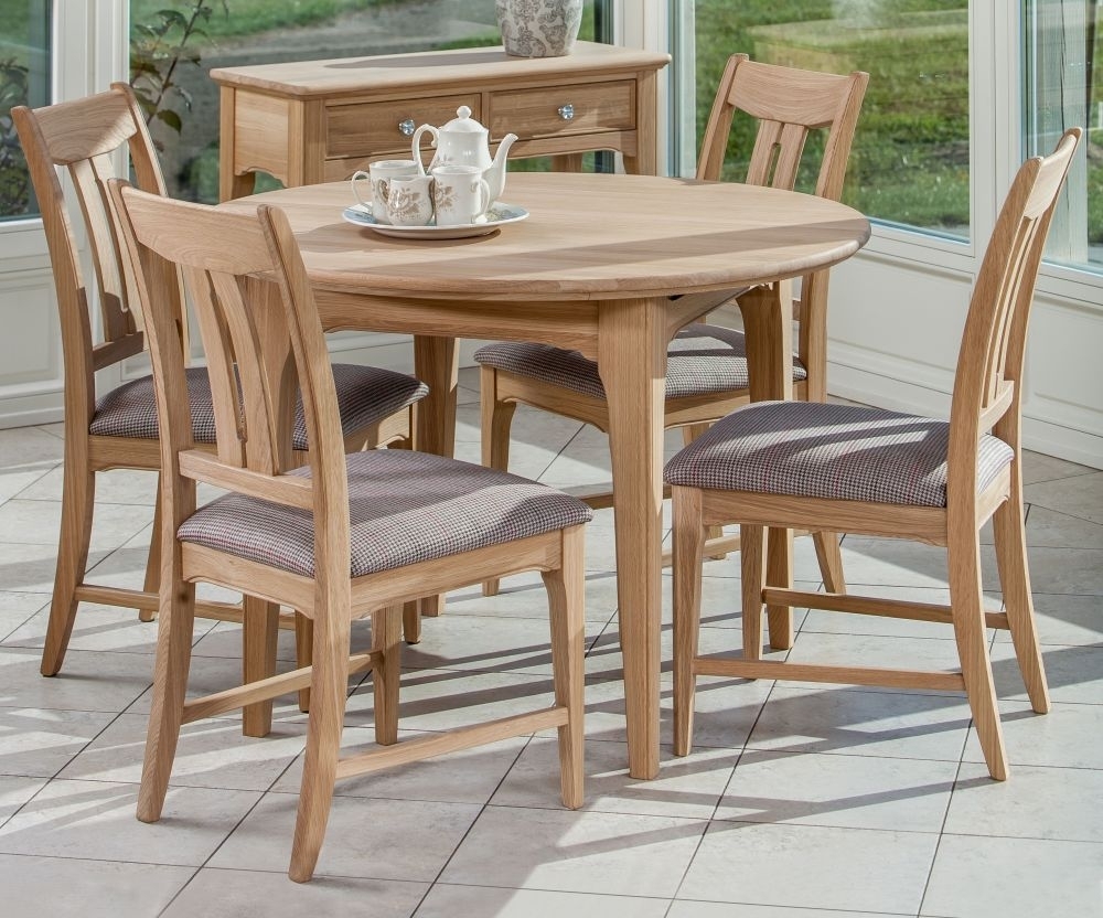 Product photograph of Tch New England Oak Round Extending Dining Table from Choice Furniture Superstore.