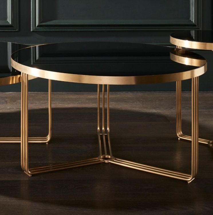 Product photograph of Gillmore Space Finn Black Glass And Brass Brushed Round Coffee Table from Choice Furniture Superstore.