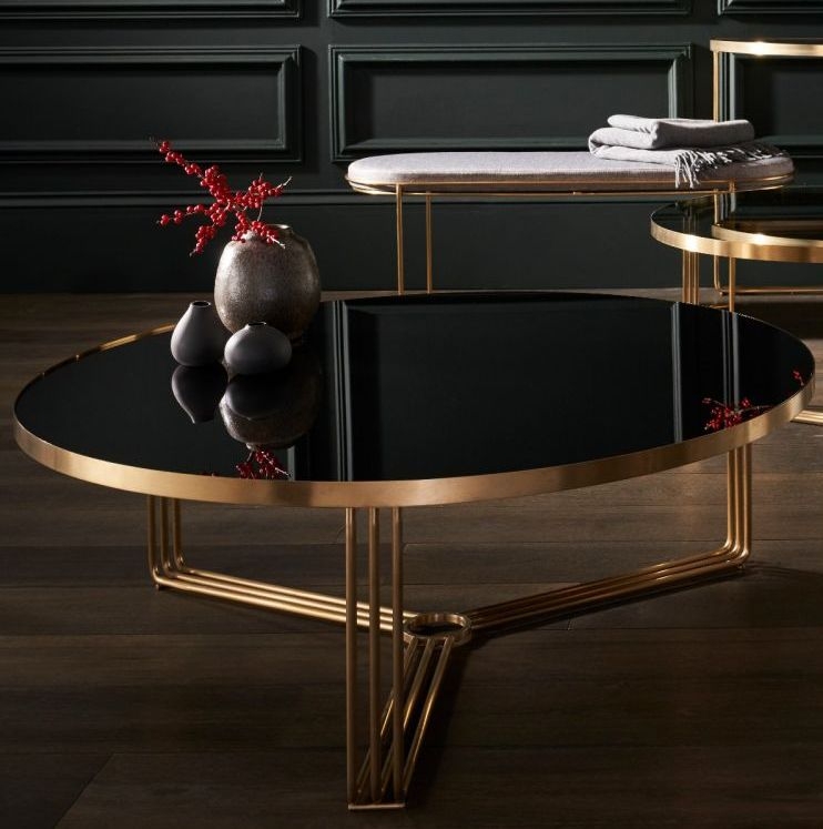 Product photograph of Finn Black Glass And Brass Metal Large Round Coffee Table from Choice Furniture Superstore.