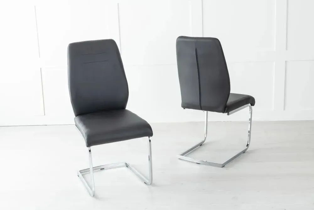 Product photograph of Oslo Black Leather Dining Chair With Stainless Steel Cantiliver Base from Choice Furniture Superstore.