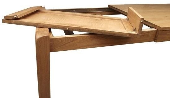Product photograph of Curve Oak 4 Seater Extending Dining Table from Choice Furniture Superstore.