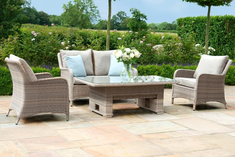 Product photograph of Maze Cotswold 2 Seat Rattan Sofa Dining Set With Rising Table And Footstools from Choice Furniture Superstore.