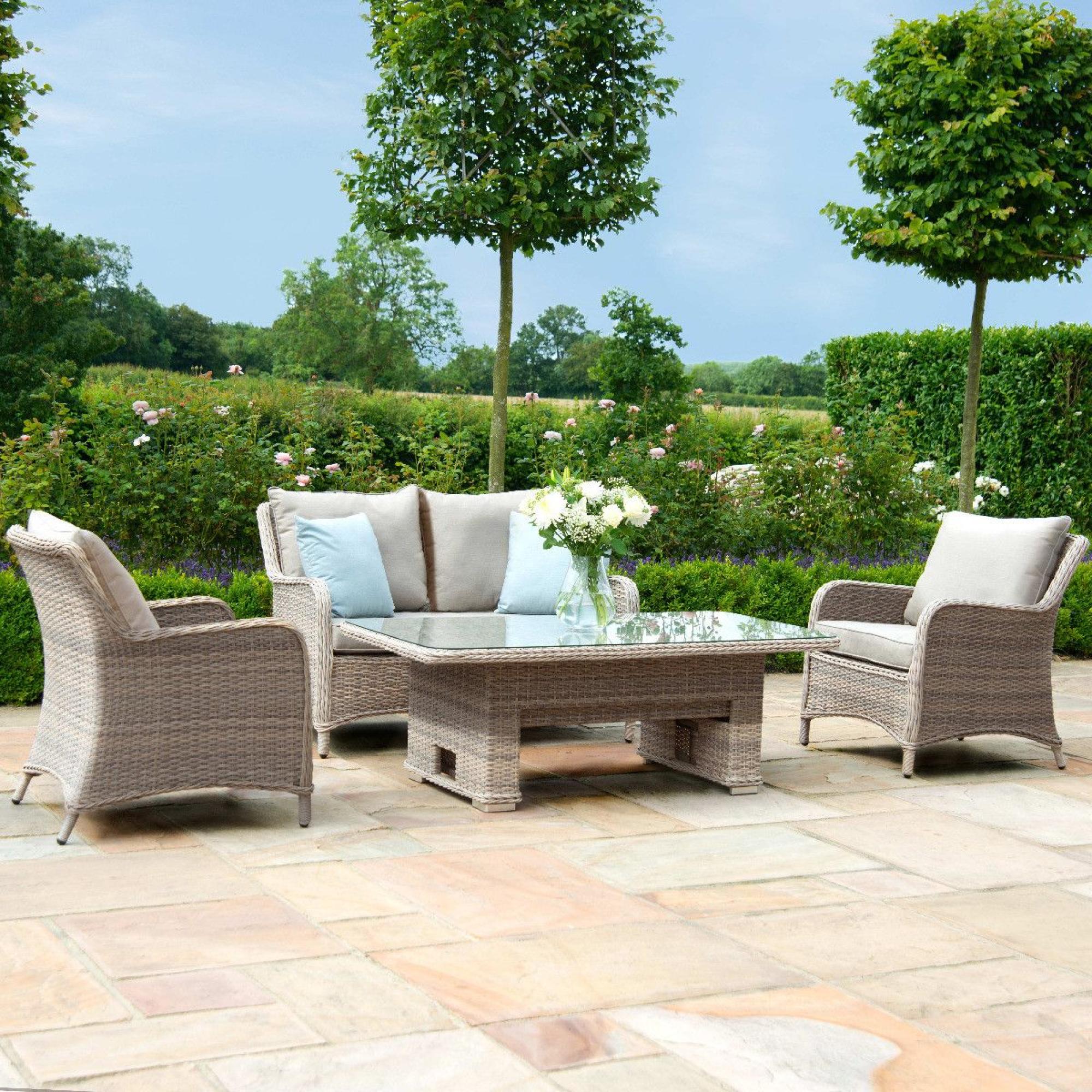Product photograph of Maze Cotswold 2 Seat Rattan Sofa Dining Set With Rising Table And Footstools from Choice Furniture Superstore.