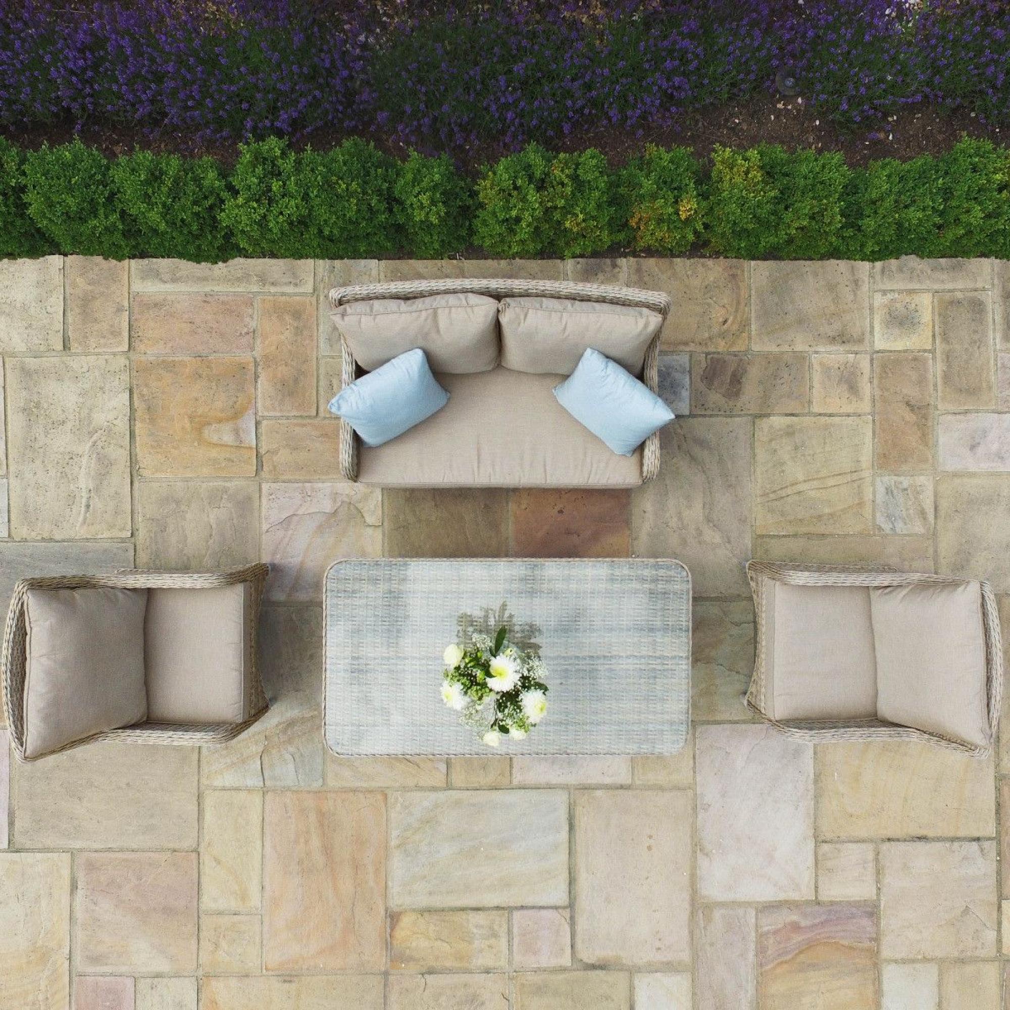 Product photograph of Maze Cotswold 2 Seat Rattan Sofa Dining Set With Rising Table And Footstools from Choice Furniture Superstore.