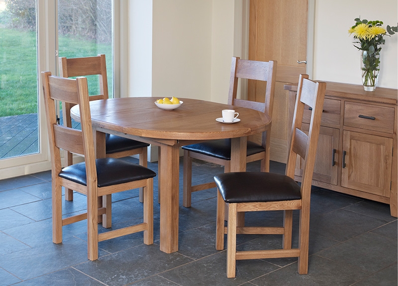 Product photograph of Hampshire Oak Round 2 Seater Extending Dining Table from Choice Furniture Superstore.