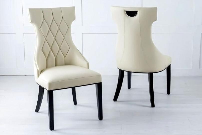 Product photograph of Mimi Cream Dining Chair Leather - Faux Pu With Black Wooden Legs from Choice Furniture Superstore.