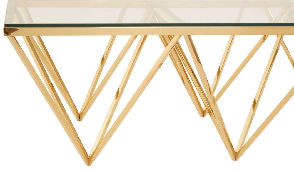 Product photograph of Kelley Glass Top And Gold Spike Triangle Base Coffee Table from Choice Furniture Superstore.