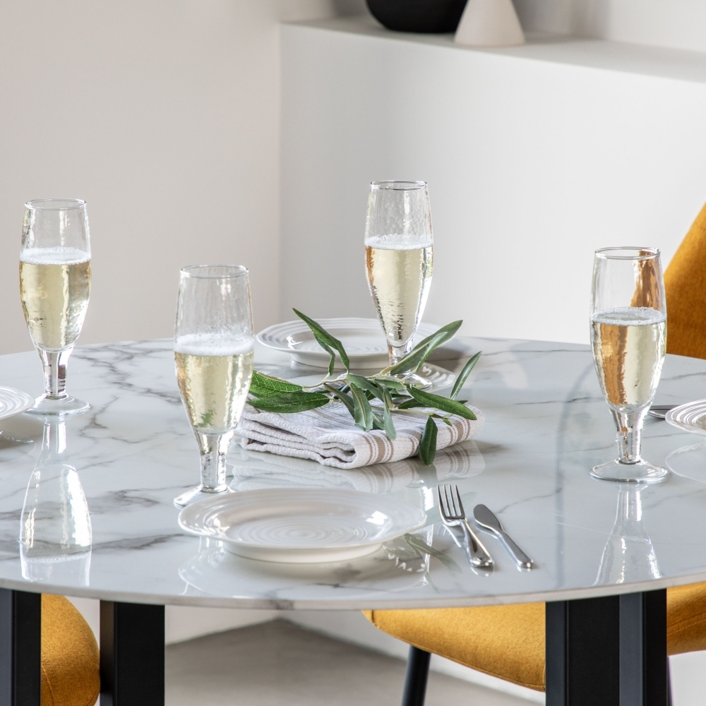 Product photograph of Connolly 110cm White Marble Effect Round Dining Table from Choice Furniture Superstore.