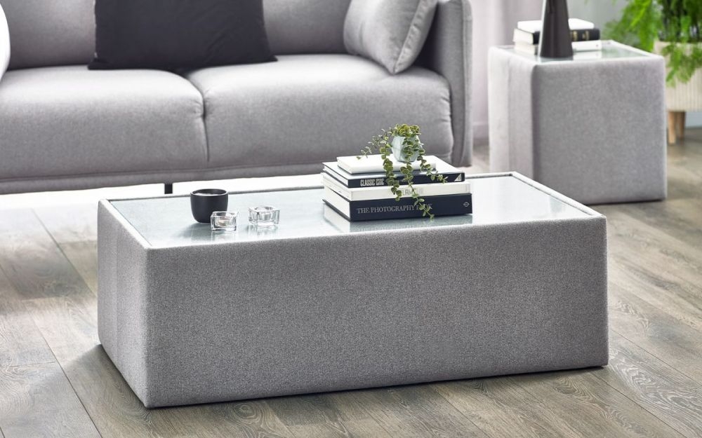 Product photograph of Rohe Grey Fabric Glass Top Coffee Table from Choice Furniture Superstore.