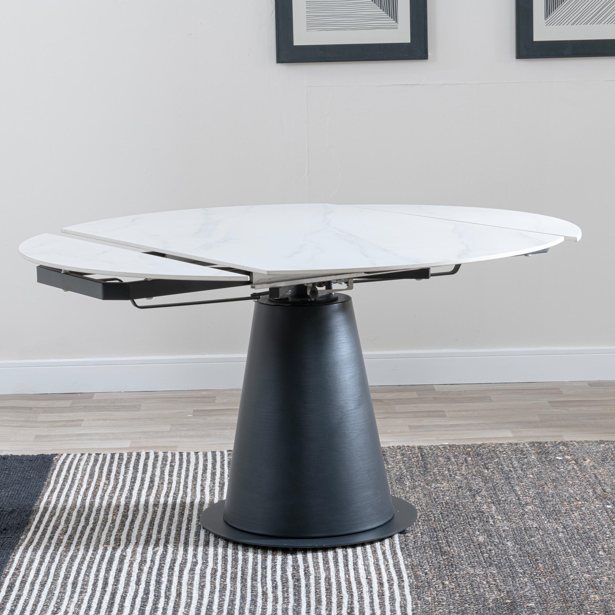 Product photograph of Carrara 135cm White Ceramic Round Dining Table With Black Pedestal Base from Choice Furniture Superstore.