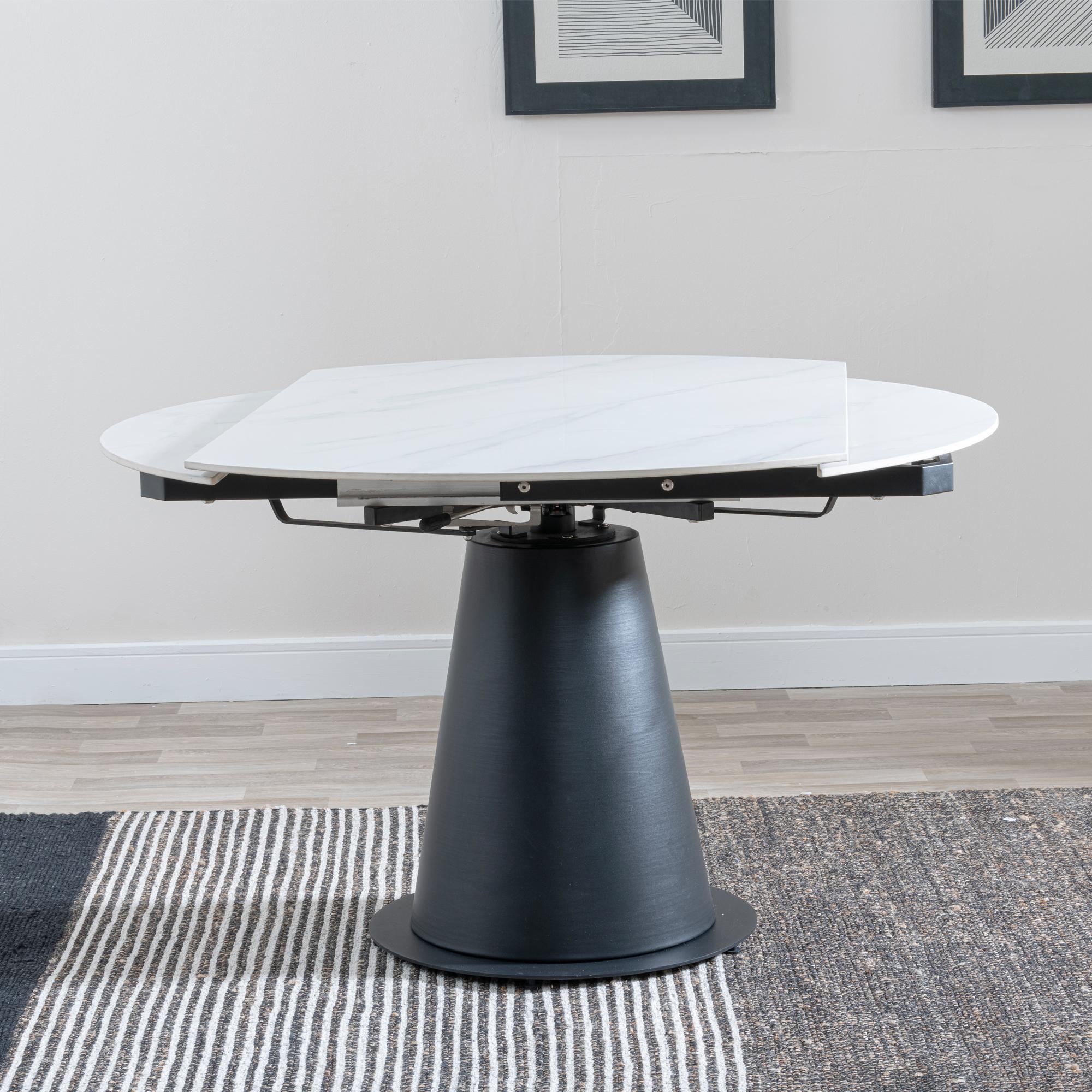 Product photograph of Carrara 135cm White Ceramic Round Dining Table With Black Pedestal Base from Choice Furniture Superstore.