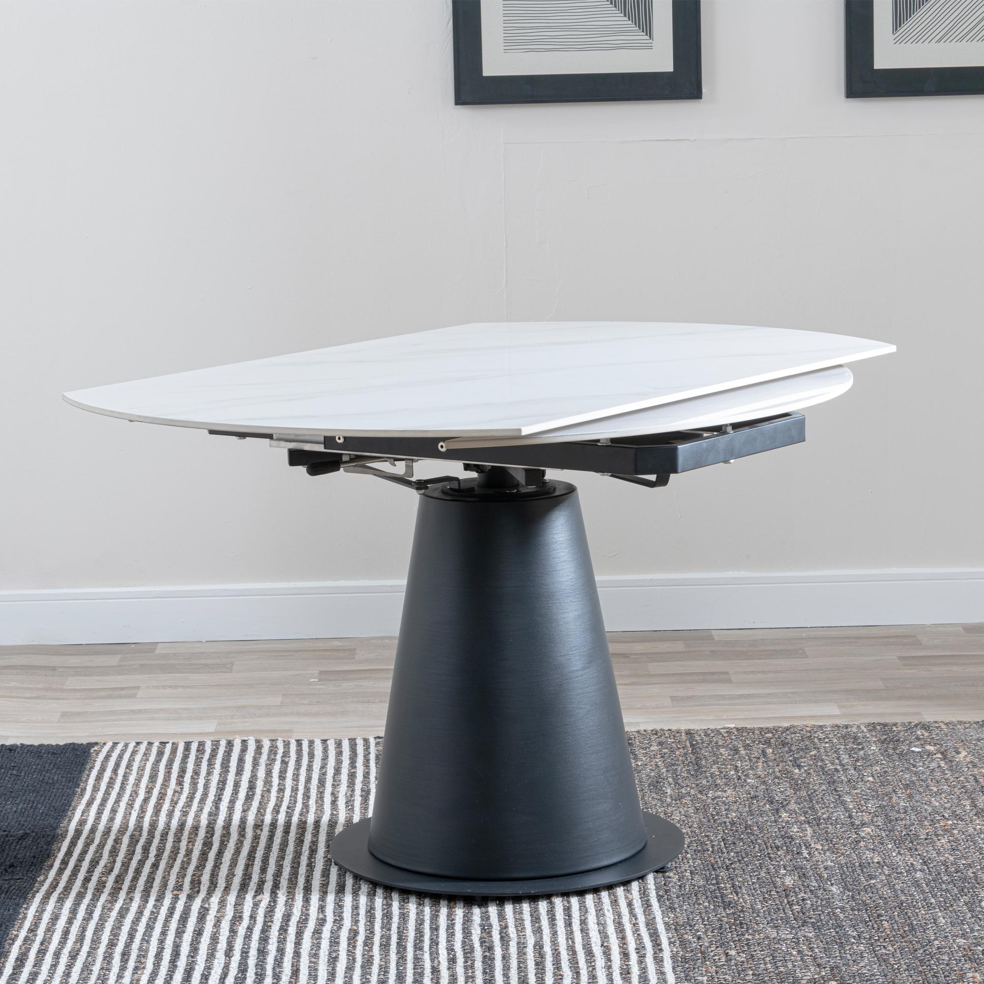 Product photograph of Carrara 135cm White Ceramic Round Dining Table With Black Pedestal Base from Choice Furniture Superstore.