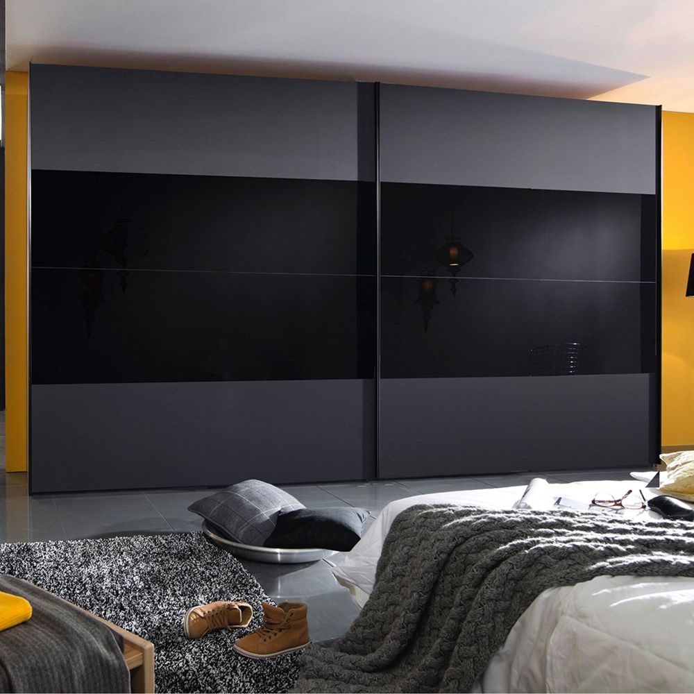 Product photograph of Rauch 20up Front 3a Sliding Wardrobe With Black Glass Front from Choice Furniture Superstore.