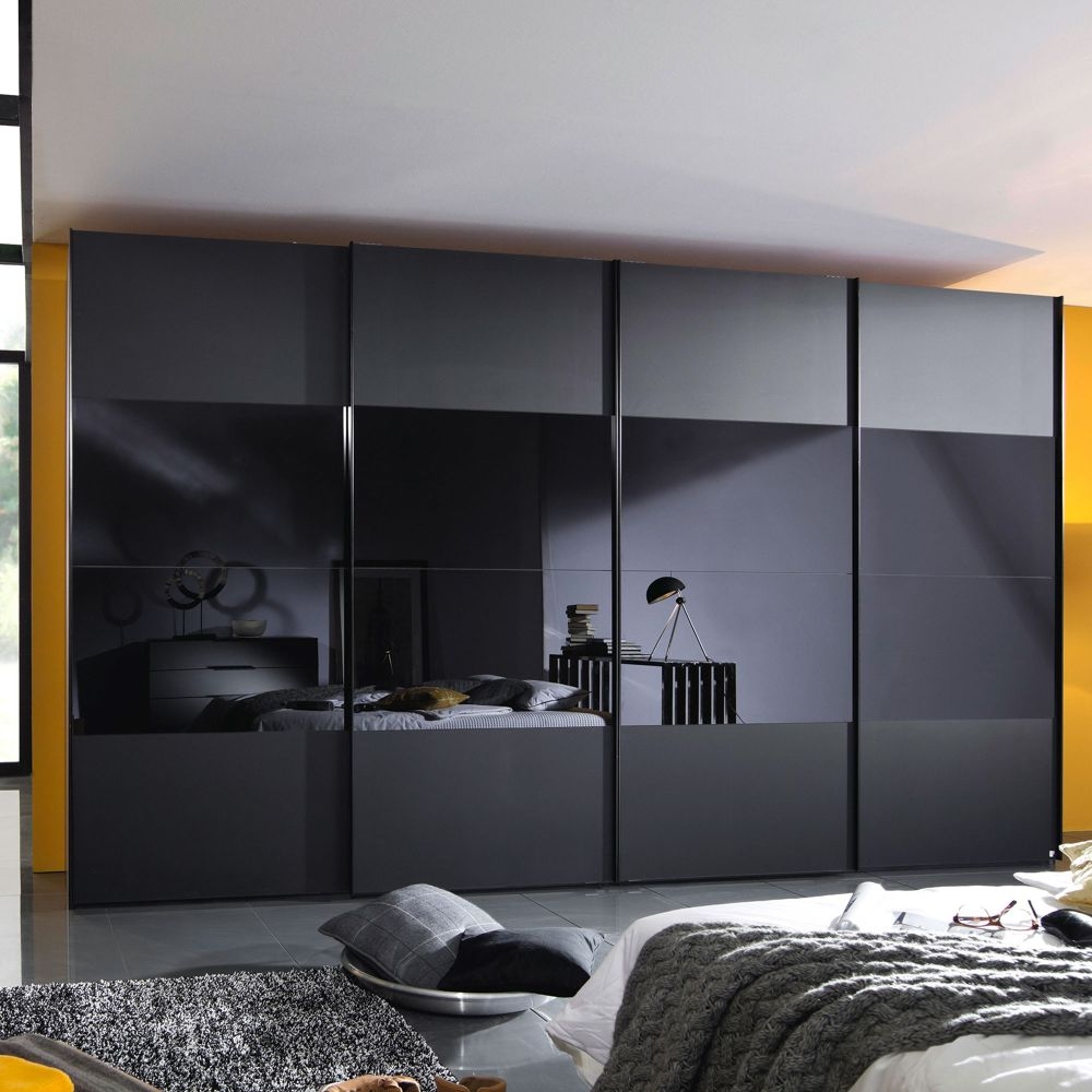 Product photograph of Rauch 20up Front 3a Sliding Wardrobe With Black Glass Front from Choice Furniture Superstore.