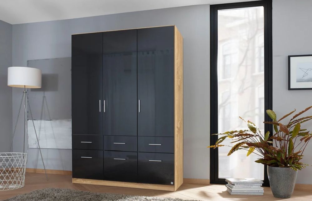 Product photograph of Rauch Celle 3 Door Charcoal Black And Oak Combi Wardrobe - 136cm from Choice Furniture Superstore.