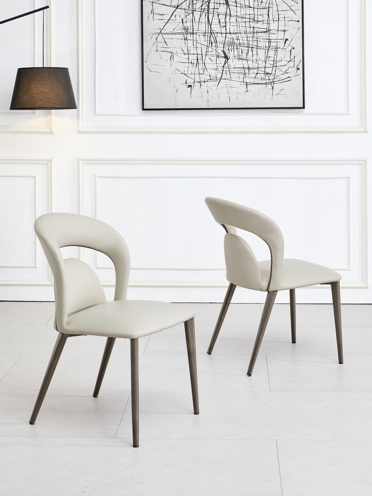 Product photograph of Dixie Taupe Dining Chair- Faux Leather With Black Legs from Choice Furniture Superstore.