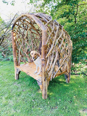 Product photograph of Root Tiki Driftwood Garden Hideaway Bench from Choice Furniture Superstore.