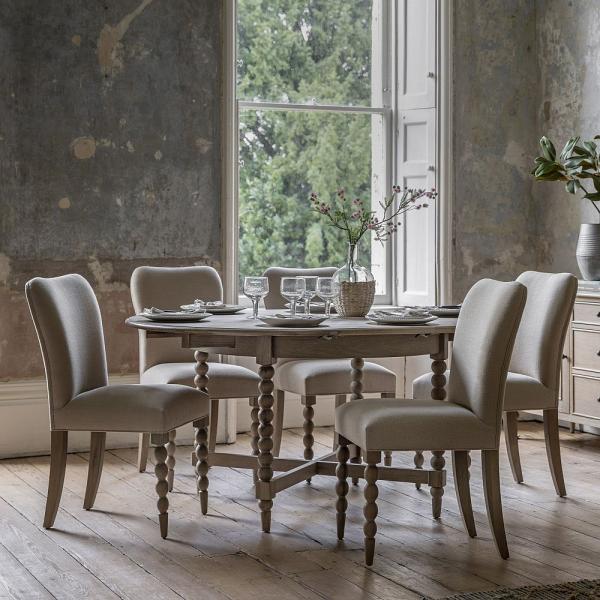 Product photograph of Artisan Oak Round Extending Dining Table With Bobbin Legs - 120cm-160cm from Choice Furniture Superstore.