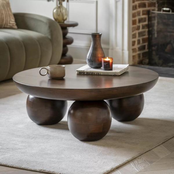 Product photograph of Sculpt Dark Mango Wood Round Coffee Table from Choice Furniture Superstore.
