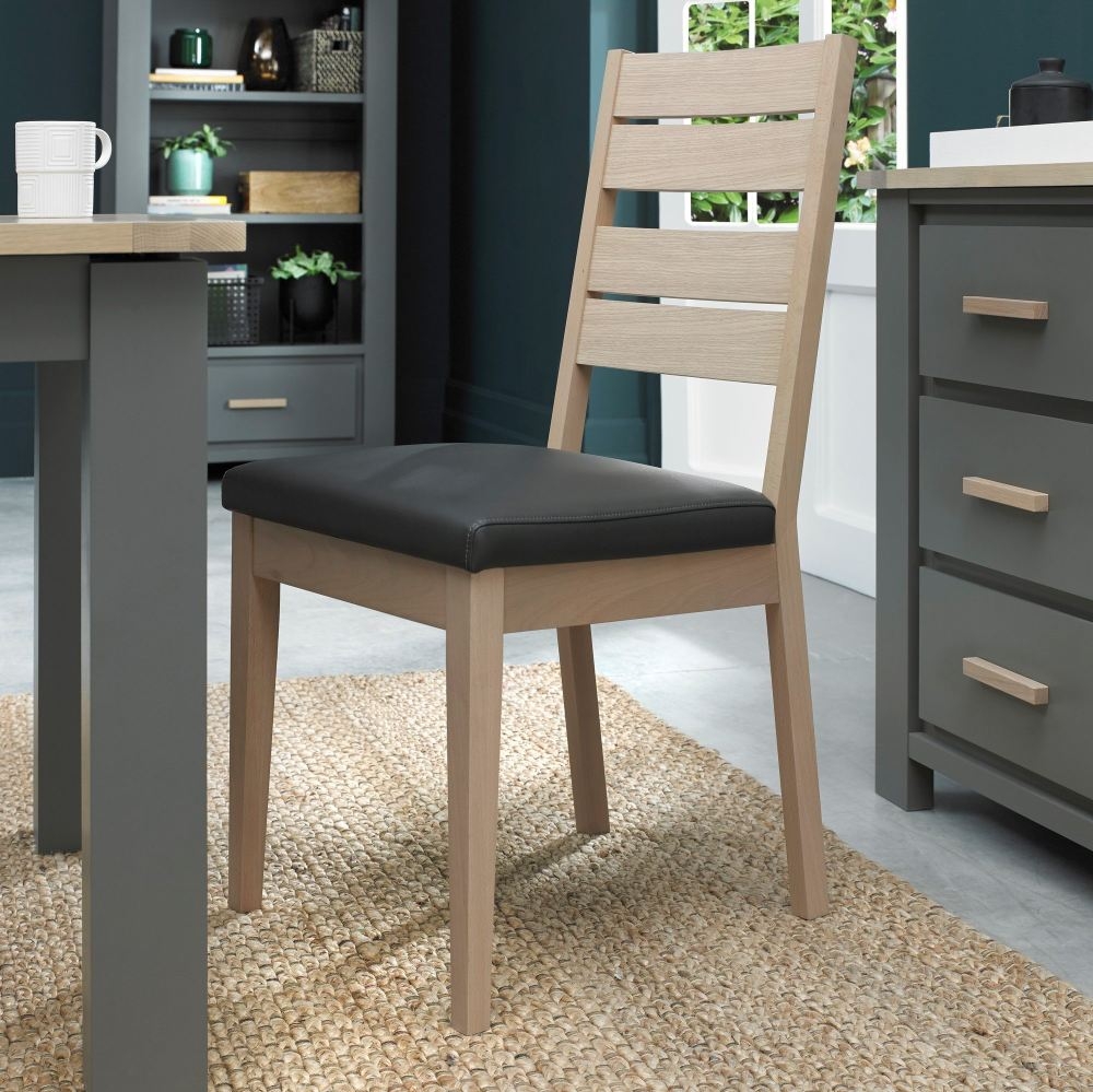Product photograph of Bentley Designs Oakham Scandi Oak Dark Grey Bonded Leather Dining Chair Sold In Pairs from Choice Furniture Superstore.
