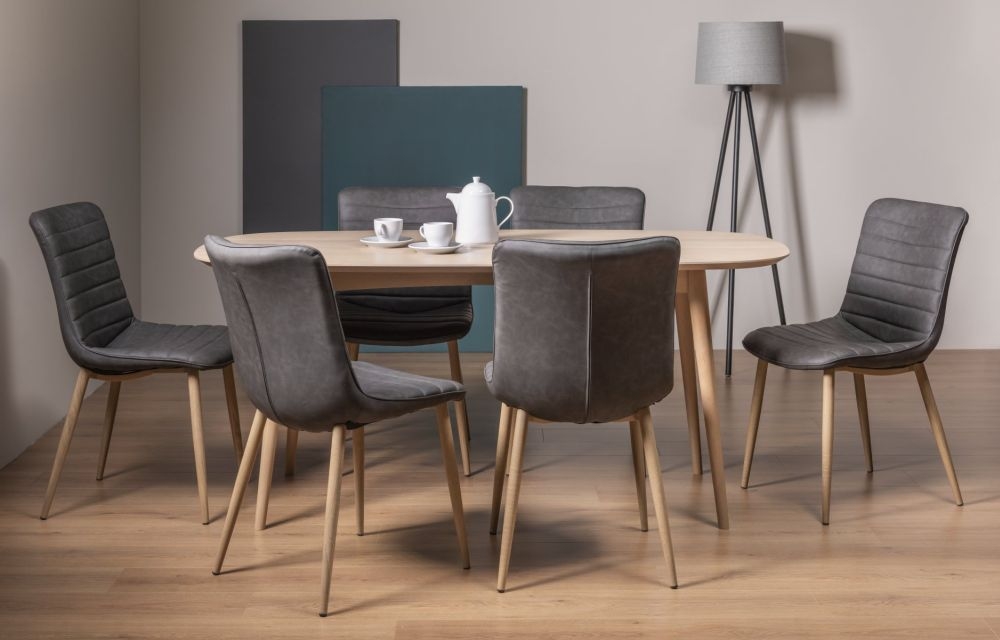 Product photograph of Bentley Designs Dansk Scandi Oak Dining Table Set With Eriksen Dark Grey Faux Leather Chairs from Choice Furniture Superstore.