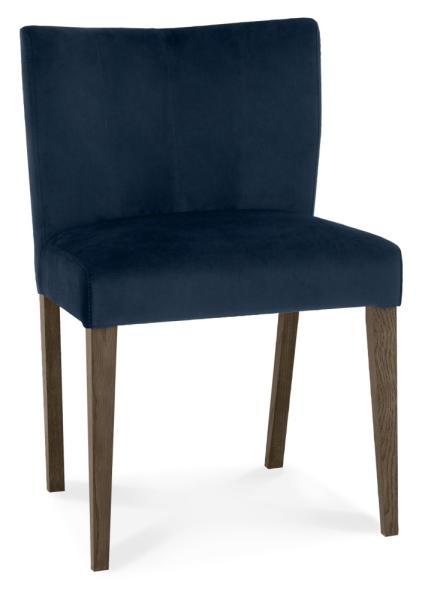 Product photograph of Bentley Designs Turin Dark Blue Velvet Fabric Low Back Dining Chair Sold In Pairs from Choice Furniture Superstore.