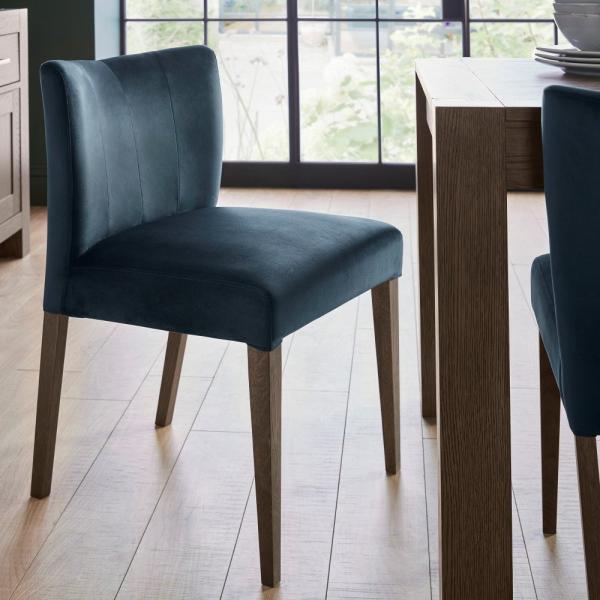 Product photograph of Bentley Designs Turin Dark Blue Velvet Fabric Low Back Dining Chair Sold In Pairs from Choice Furniture Superstore.