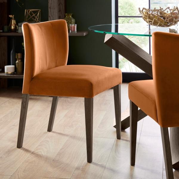 Product photograph of Bentley Designs Turin Harvest Pumpkin Velvet Fabric Low Back Dining Chair Chair Sold In Pairs from Choice Furniture Superstore.