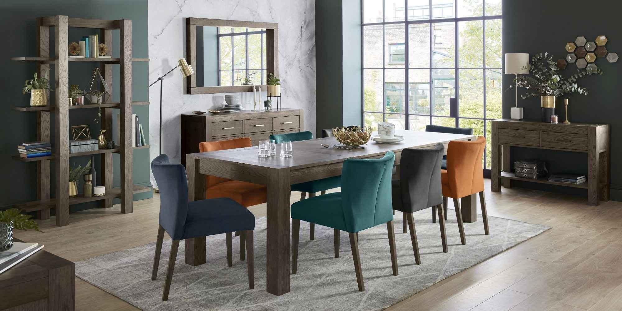 Product photograph of Bentley Designs Turin Dark Oak 6-10 Seater Extending Dining Table With 6 Lewis Distressed Dark Grey Fabric Cantilever Chairs from Choice Furniture Superstore.