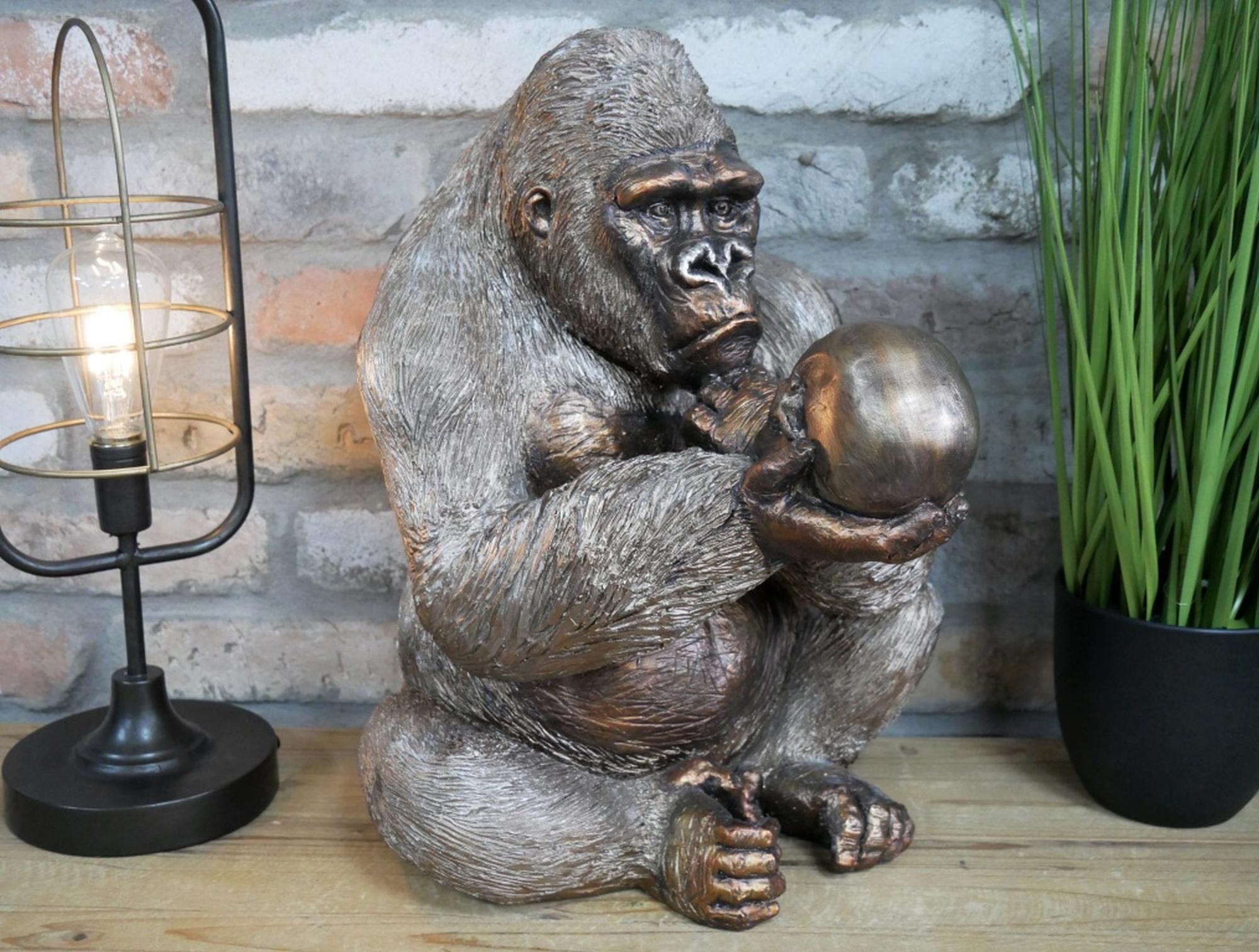 Product photograph of Large Gorilla Statue Holding Skull Ornament from Choice Furniture Superstore.