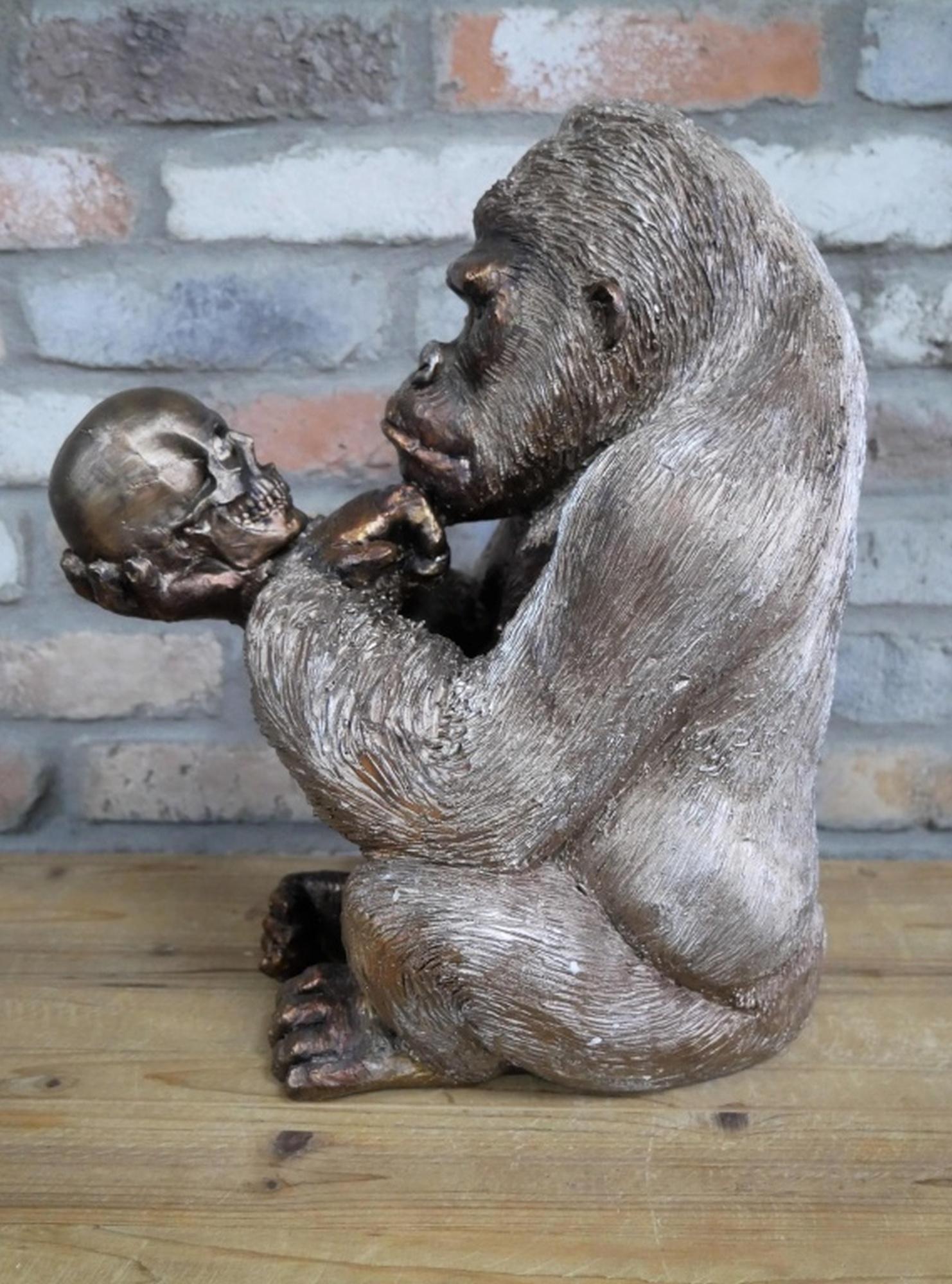 Product photograph of Large Gorilla Statue Holding Skull Ornament from Choice Furniture Superstore.